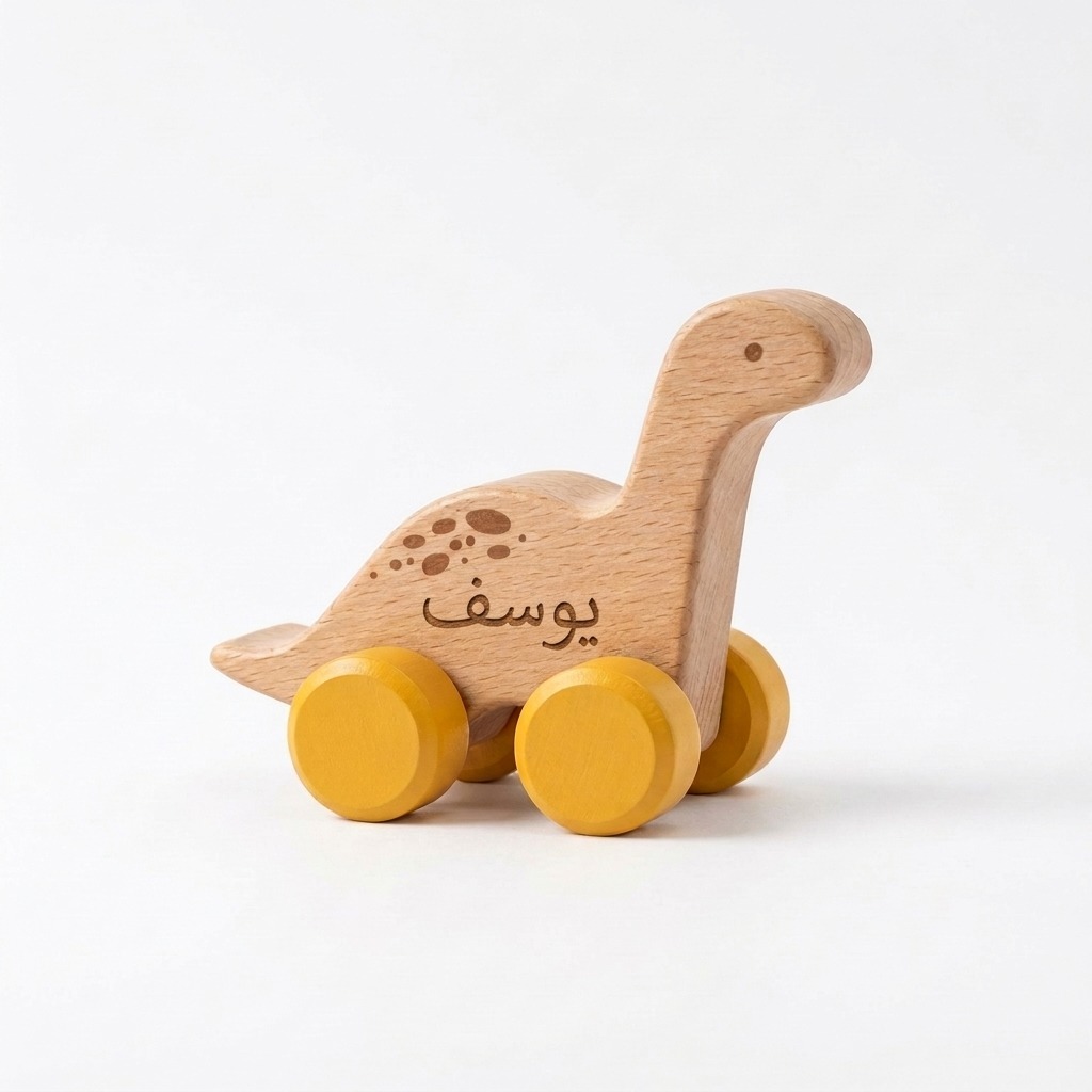 Dinosaur Wooden Push Toy 3 Personalized gugu wooden long neck dinosaur push toy with yellow wheels and an engraved Arabic name.